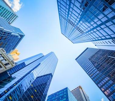 A ground shot of skyscrapers in a city