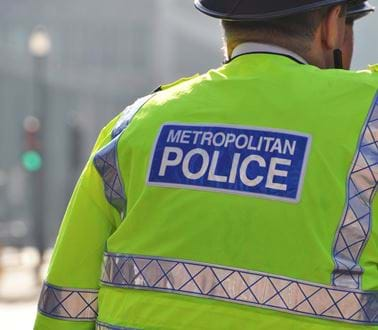 Police officers in high vis jackets on a London street