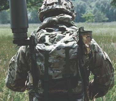 A soldier wearing a RESOLVE from the back