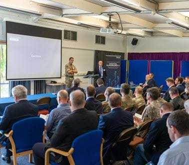 Paul MacGregor, Managing Director, and Colonel Ash address members of the ZODIAC framework