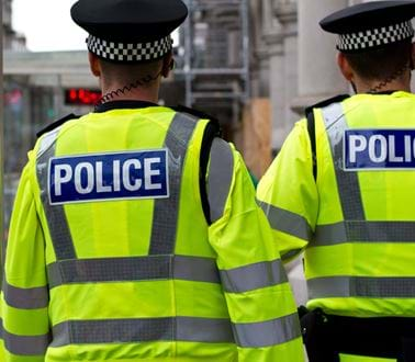 Police officers in high vis jackets on a London street